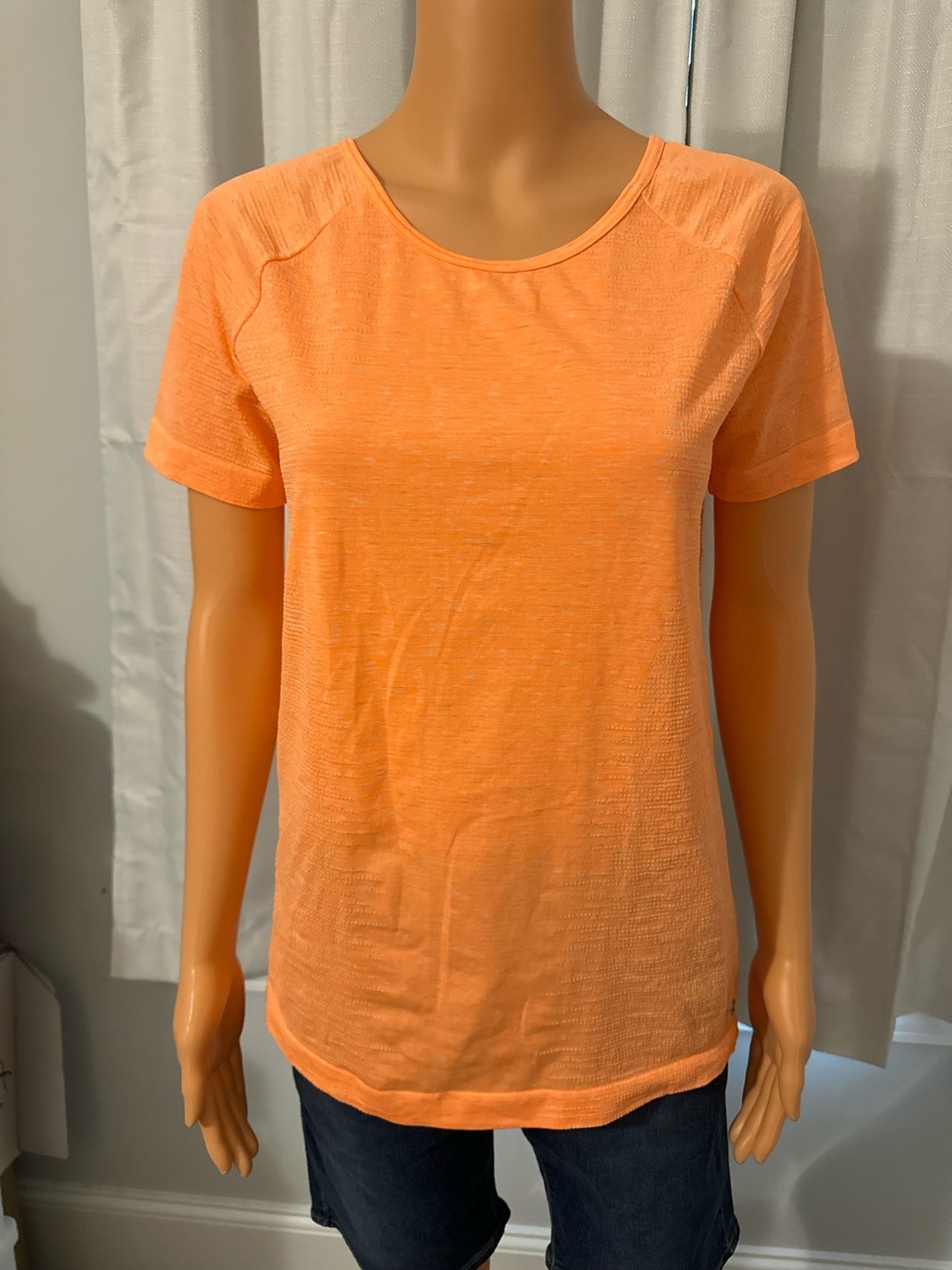Cool Under Armour size M neon orange drop back short sleeve heat gear shirt